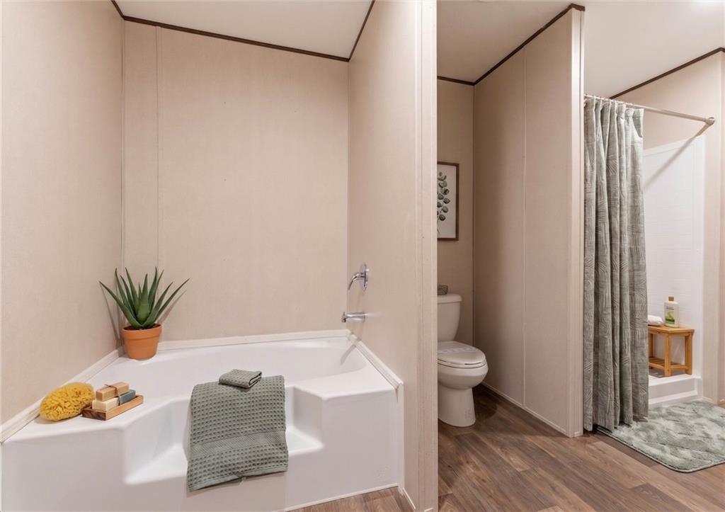 66 Martin Byers Road Dahlonega, GA 30533 - Photo 21 of 32 a bathroom with a toilet and a shower curtain