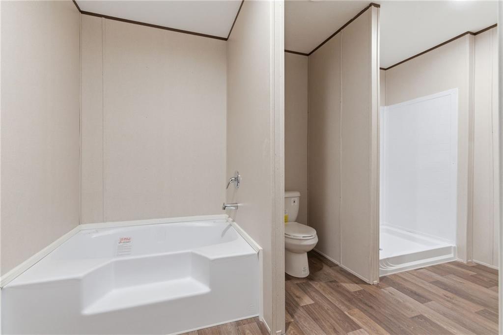 66 Martin Byers Road Dahlonega, GA 30533 - Photo 22 of 32 a bathroom with a bathtub and a toilet