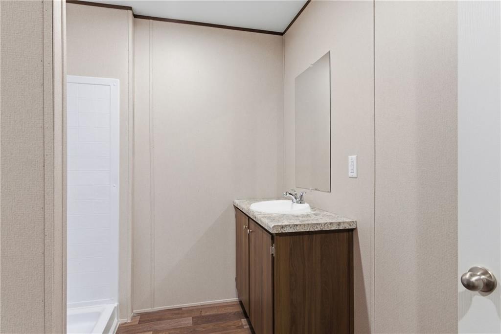 66 Martin Byers Road Dahlonega, GA 30533 - Photo 23 of 32 a bathroom with a sink and a mirror