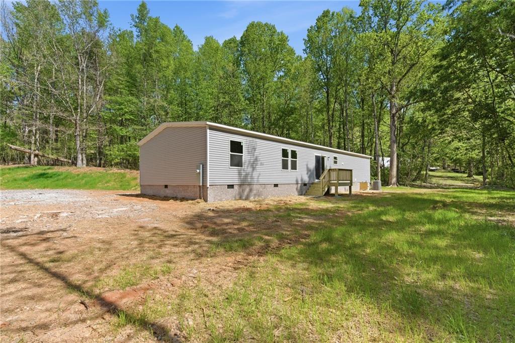 66 Martin Byers Road Dahlonega, GA 30533 - Photo 31 of 32 a house view with a garden space