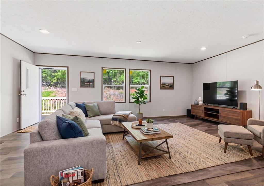 66 Martin Byers Road Dahlonega, GA 30533 - Photo 4 of 32 a living room with furniture and a flat screen tv