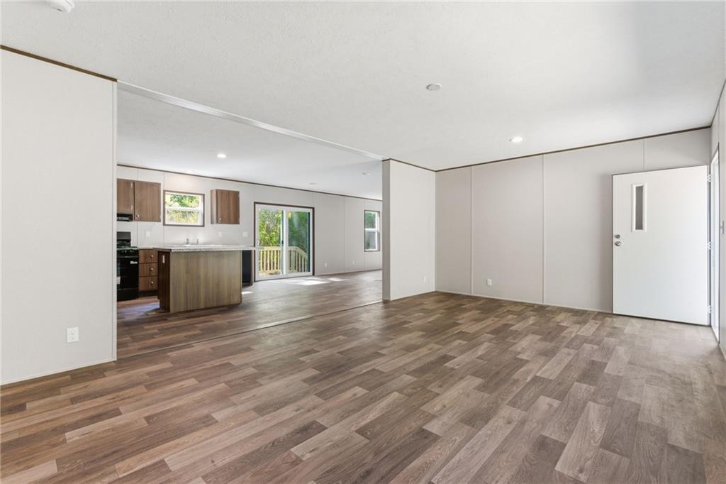 66 Martin Byers Road Dahlonega, GA 30533 - Photo 7 of 32 a view of empty room with kitchen and window