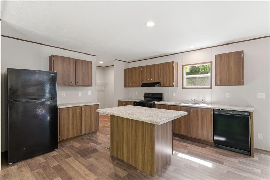 66 Martin Byers Road Dahlonega, GA 30533 - Photo 10 of 32 a kitchen with a refrigerator a sink dishwasher with a stove and refrigerator