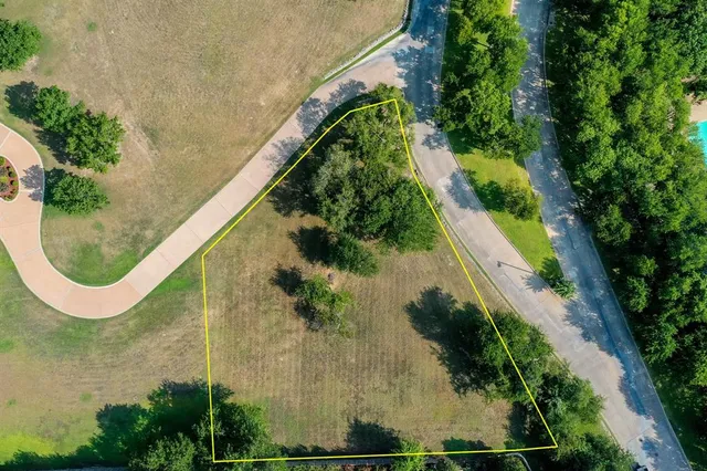 an aerial view of a residential houses with outdoor space and swimming pool