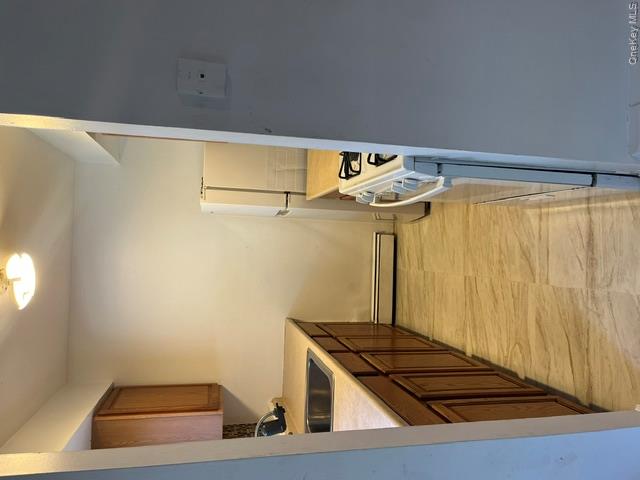 30 Tanager Road, Unit 3001 Monroe, NY 10950 - Photo 14 of 20 a view of a kitchen from a corridor