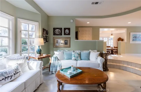 a living room with furniture and a table