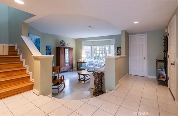 a view of a livingroom with workspace and a window