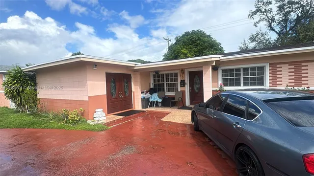 a house view with a garden space