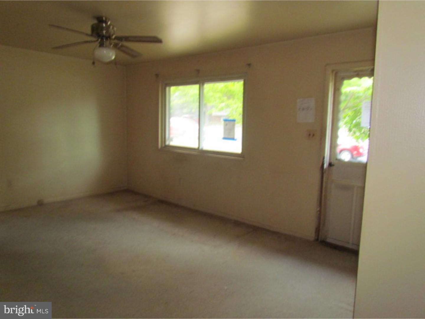 472 Fordham Road Wenonah, NJ 08090 - Photo 2 of 8 an empty room with a window and a fan