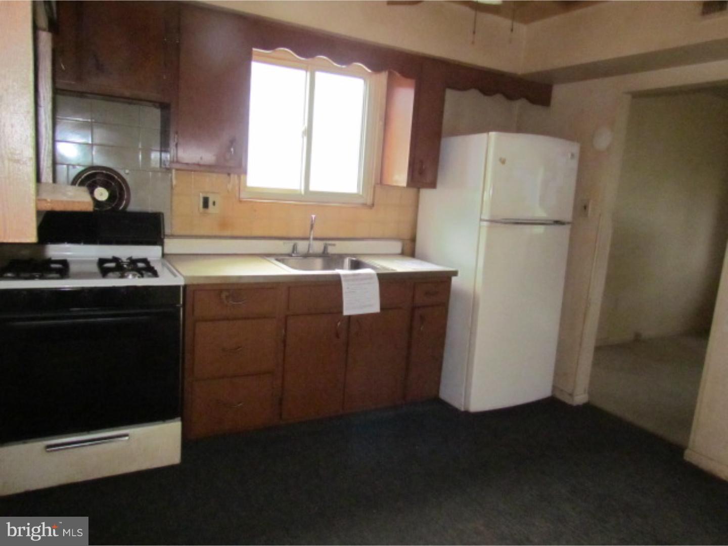 472 Fordham Road Wenonah, NJ 08090 - Photo 3 of 8 a kitchen with a refrigerator sink stove and cabinets