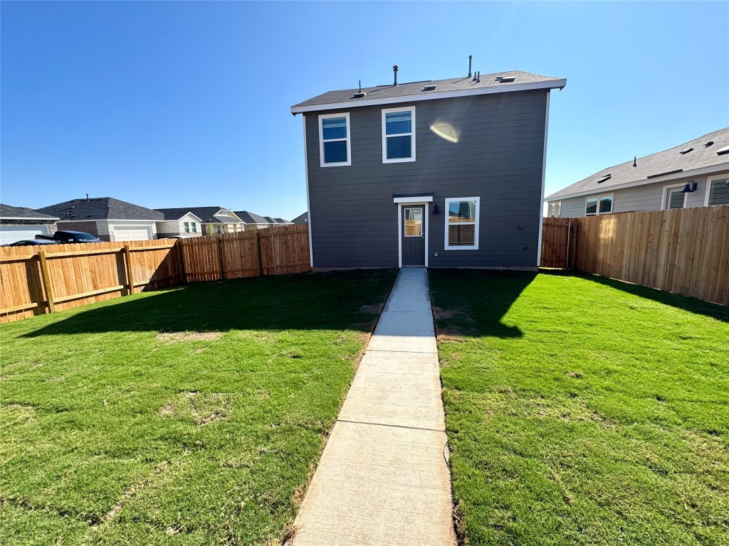 110 Haw Branch View Kyle, TX 78640 - Photo 12 of 15 Rear view of house featuring a fenced backyard