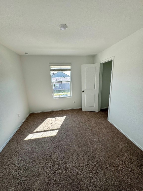 110 Haw Branch View Kyle, TX 78640 - Photo 8 of 15 Unfurnished bedroom with carpet flooring and baseboards
