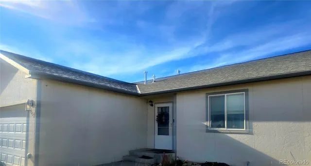 a backyard of a house with seating space
