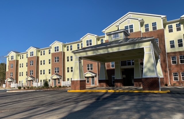 a view of a building with a street
