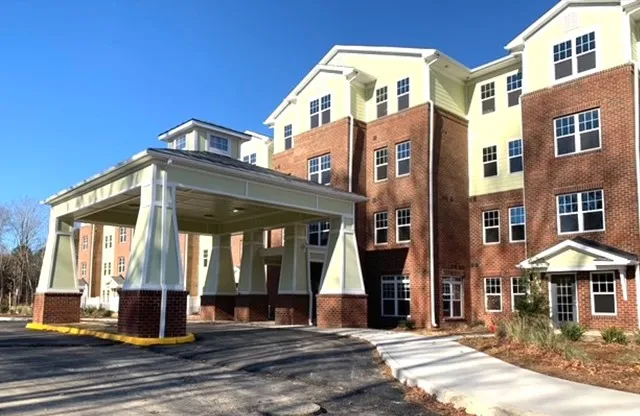 a view of a building with a yard