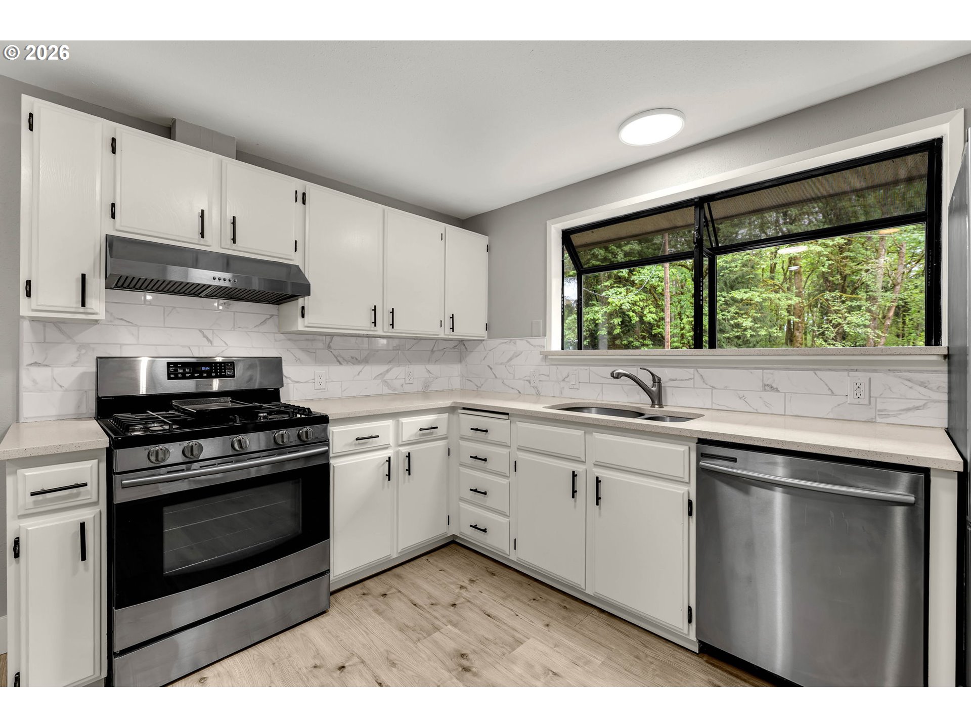30921 Northwest Spencer Road La Center, WA 98642 - Photo 14 of 39 a kitchen with stainless steel appliances granite countertop a stove a sink and a microwave