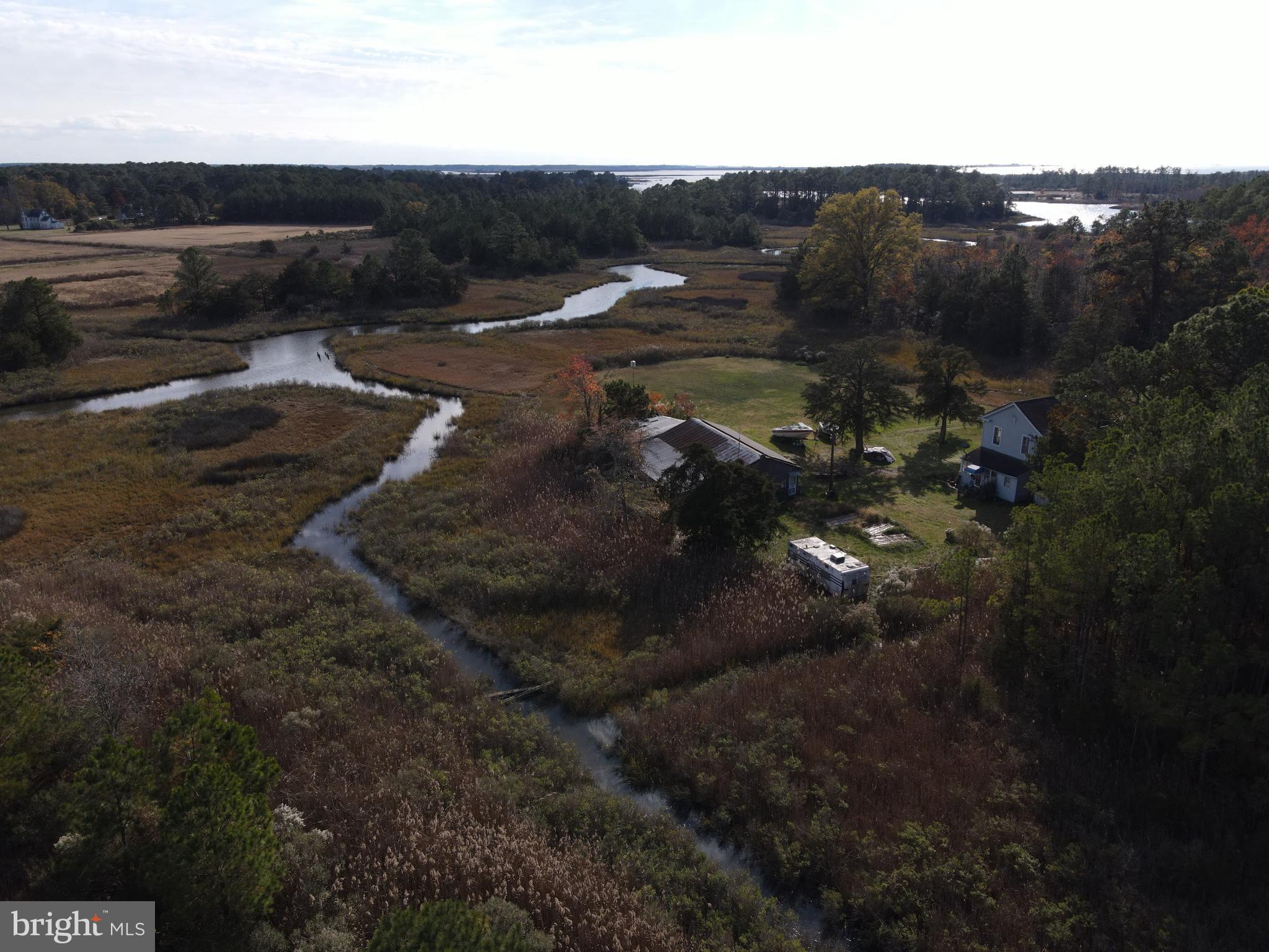 a view of a street with a yard