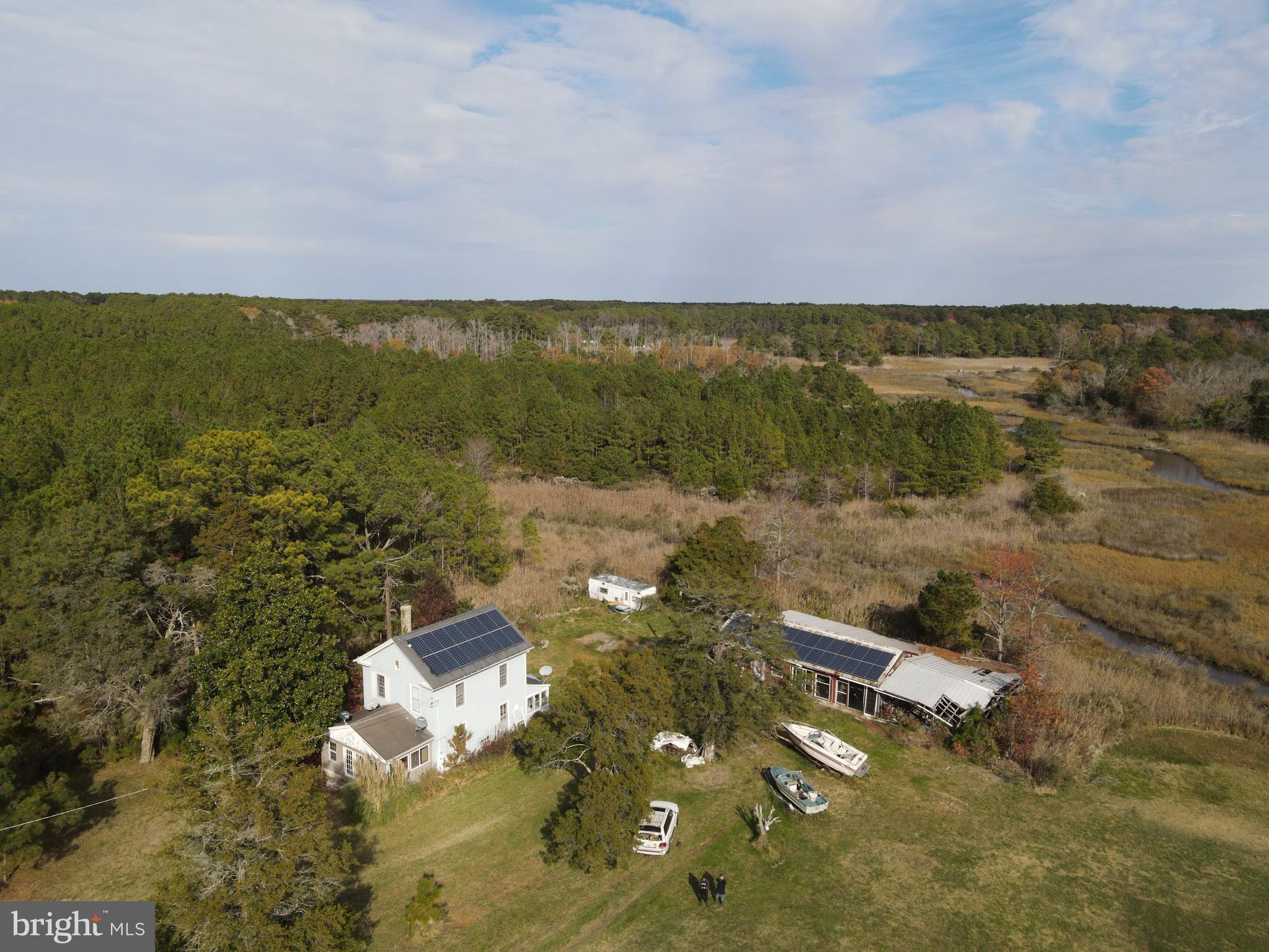 10407 William Sharpless Road Princess Anne, MD 21853 - Photo 3 of 7 an aerial view of ocean with residential houses with outdoor space