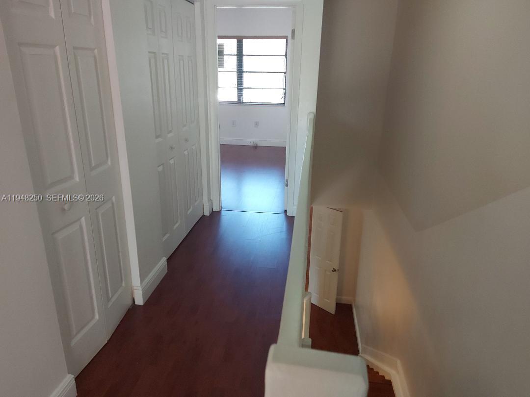 20033 Northeast 2nd Place Miami, FL 33179 - Photo 16 of 23 a view of hallway with stairs