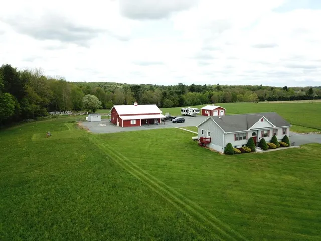 a view of a golf course with chairs