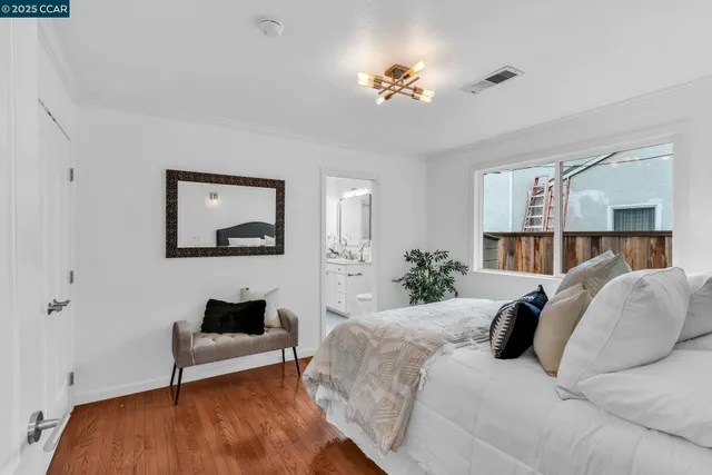 a bedroom with a bed and a table