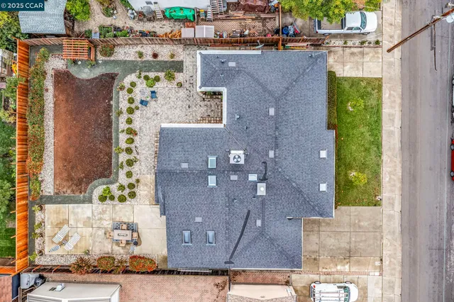 an aerial view of a house with a yard