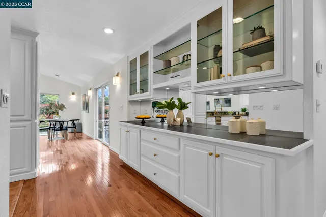 a kitchen with stainless steel appliances a sink and cabinets