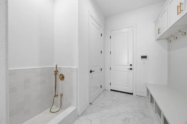 a bathroom with a sink mirror and toilet