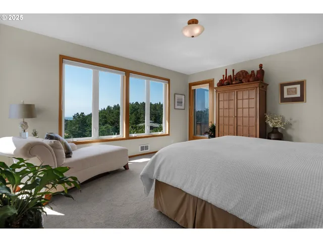 a spacious bathroom with a tub double sink and mirror