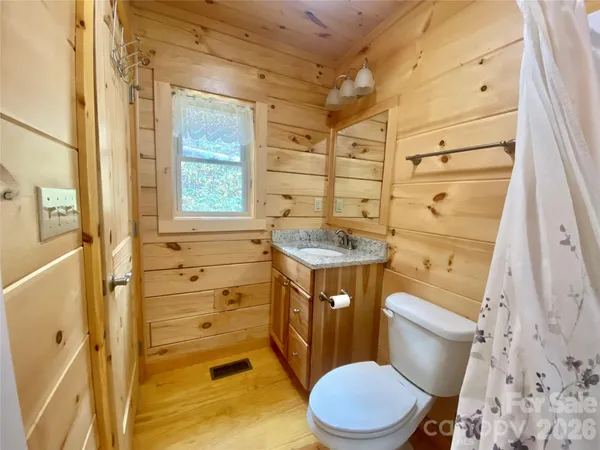 a bathroom with a shower and a sink