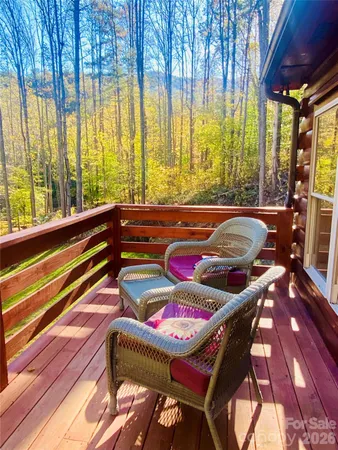 a outdoor sitting area with furniture and wooden floor