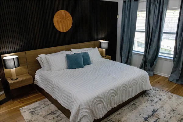 a bedroom with bed and a window