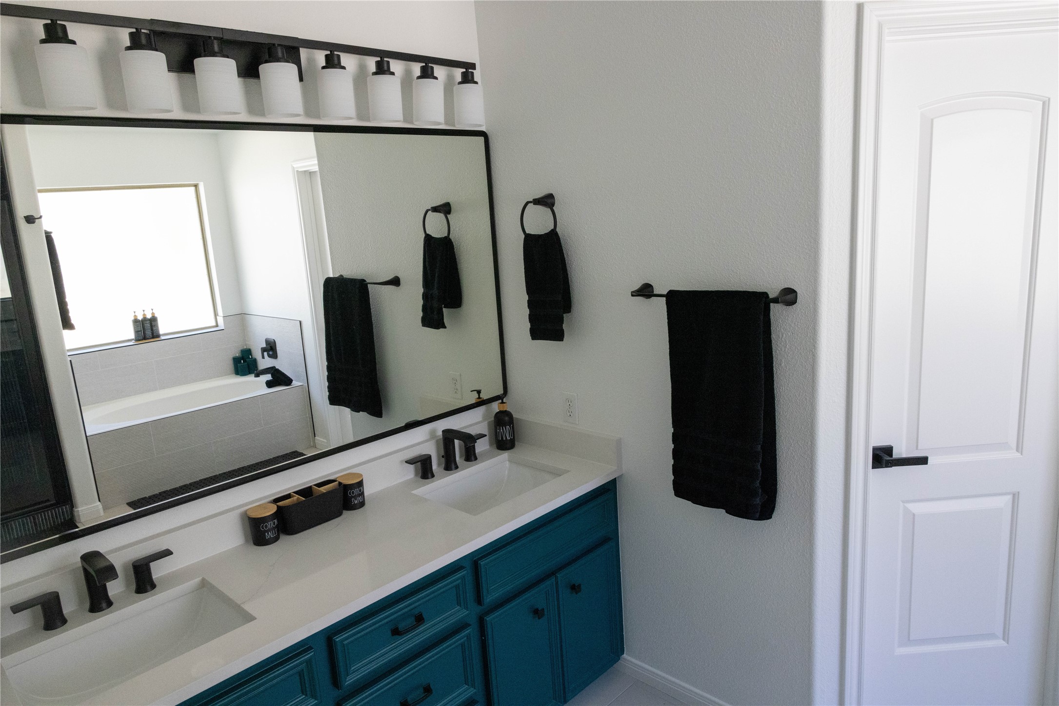 17023 Lexington Drive Conroe, TX 77385 - Photo 15 of 25 a bathroom with a sink and a mirror