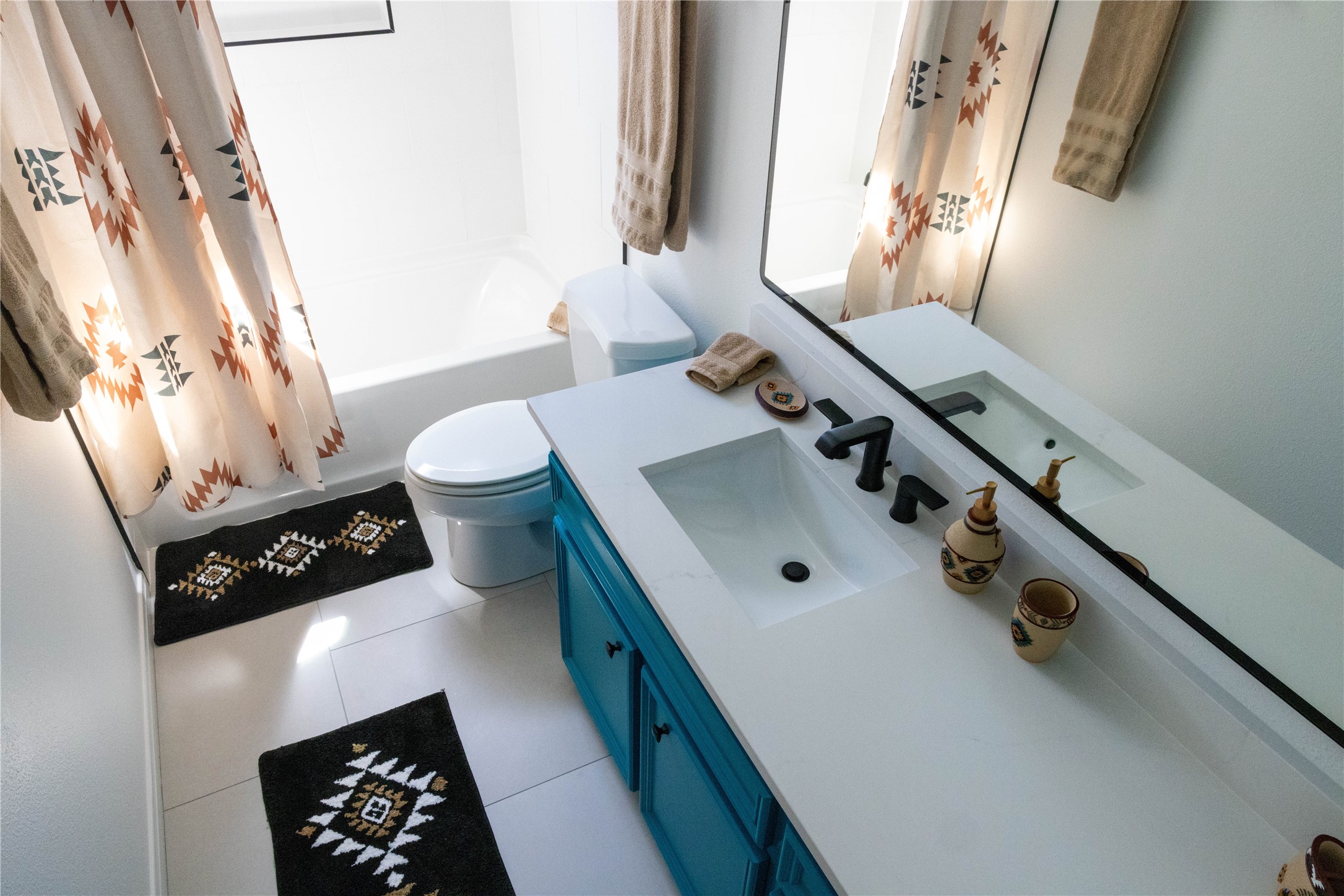 17023 Lexington Drive Conroe, TX 77385 - Photo 19 of 25 a bathroom with a sink a toilet and mirror
