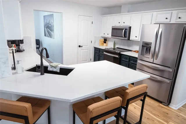 a dining room with furniture and a window