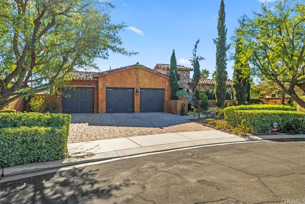 15 Cassis Circle Rancho Mirage, CA 92270 - Photo 1 of 1 a front view of a house with a yard and garage