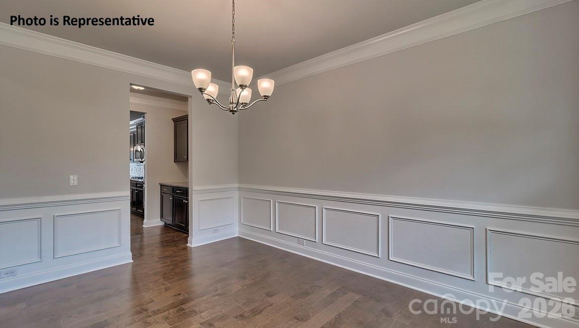 8909 Overhill Road Huntersville, NC 28078 - Photo 4 of 8 a view of a livingroom with a chandelier fan