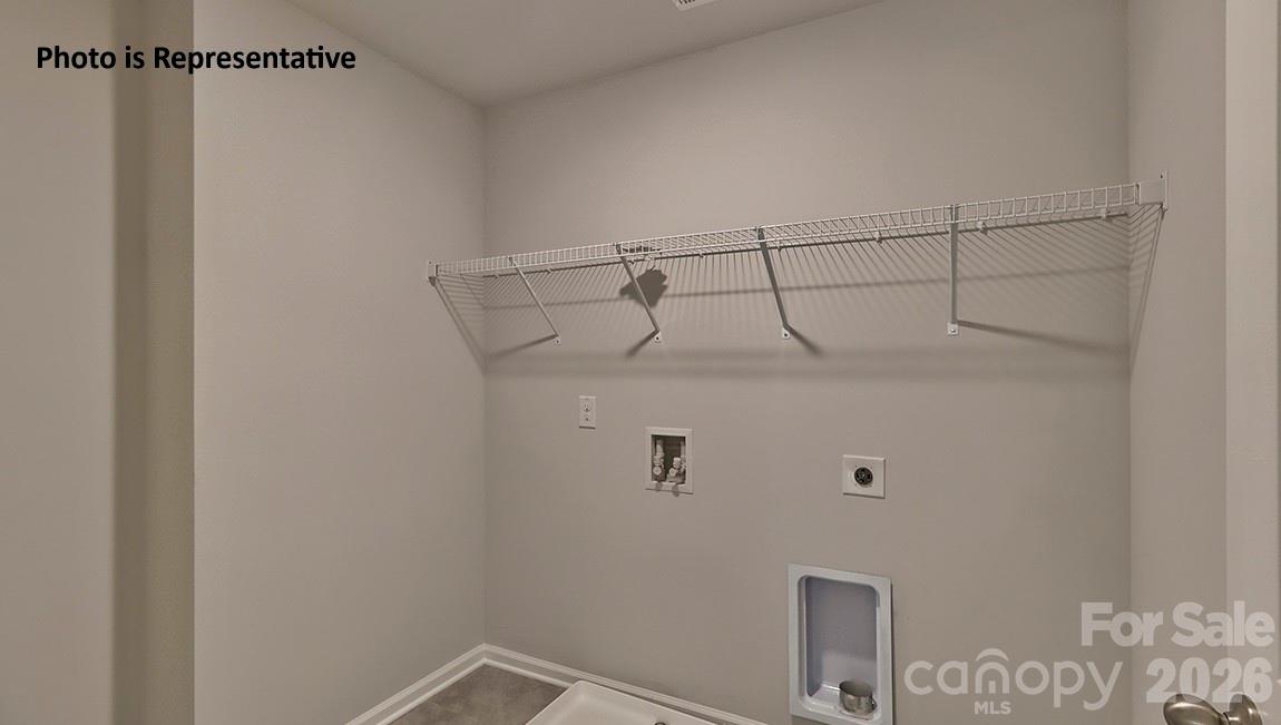 8909 Overhill Road Huntersville, NC 28078 - Photo 7 of 8 a view of a room with racks on the wall