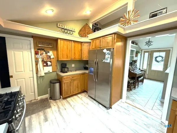 a kitchen with a refrigerator and a sink