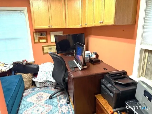 a workspace with furniture and window