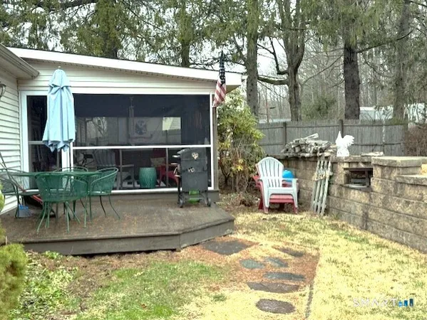 a view of a chairs and table in the patio