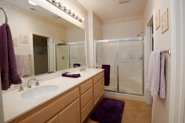 a bathroom with a shower and a bath tub