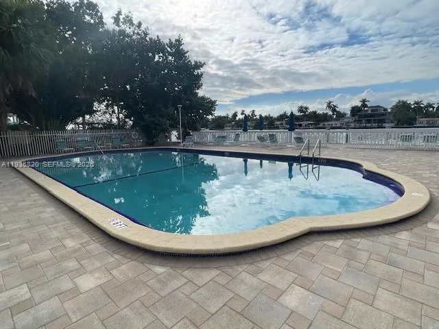 a view of a swimming pool with a terrace