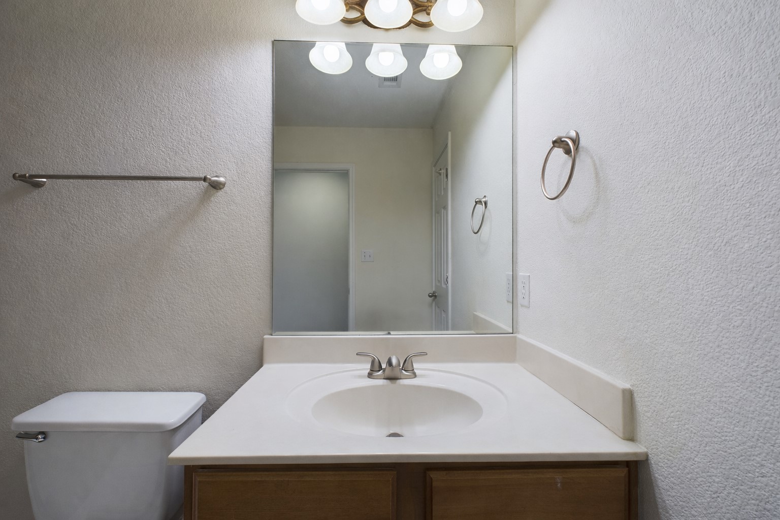 500 East 48th Street, Unit A Austin, TX 78751 - Photo 18 of 27 a bathroom with a sink and a mirror