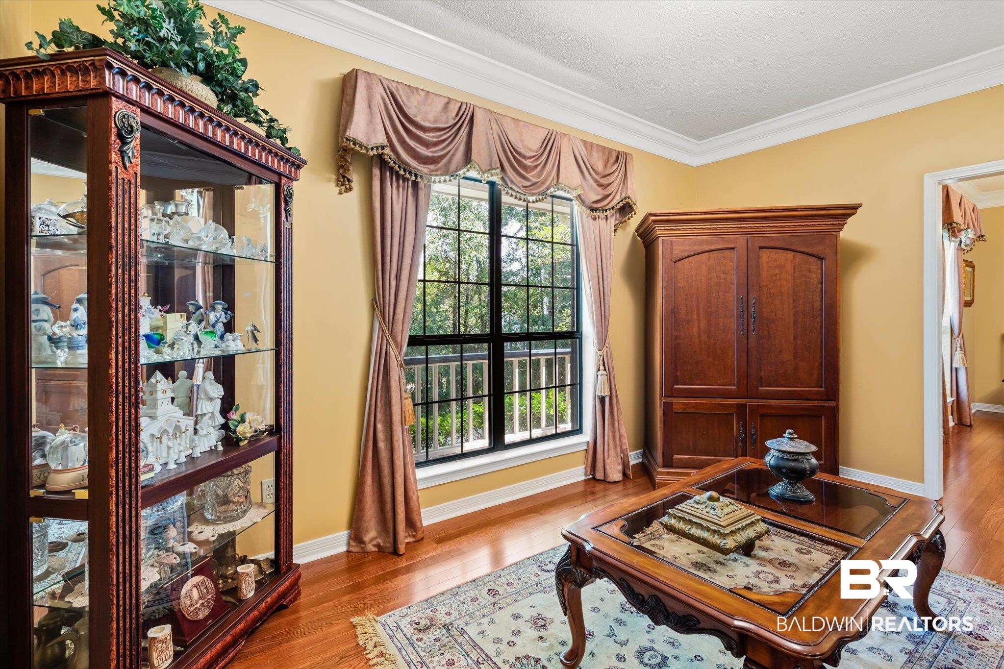 7360 Bridgewood Court Mobile, AL 36695 - Photo 4 of 30 Sitting room featuring crown molding and light hardwood / wood-style floors