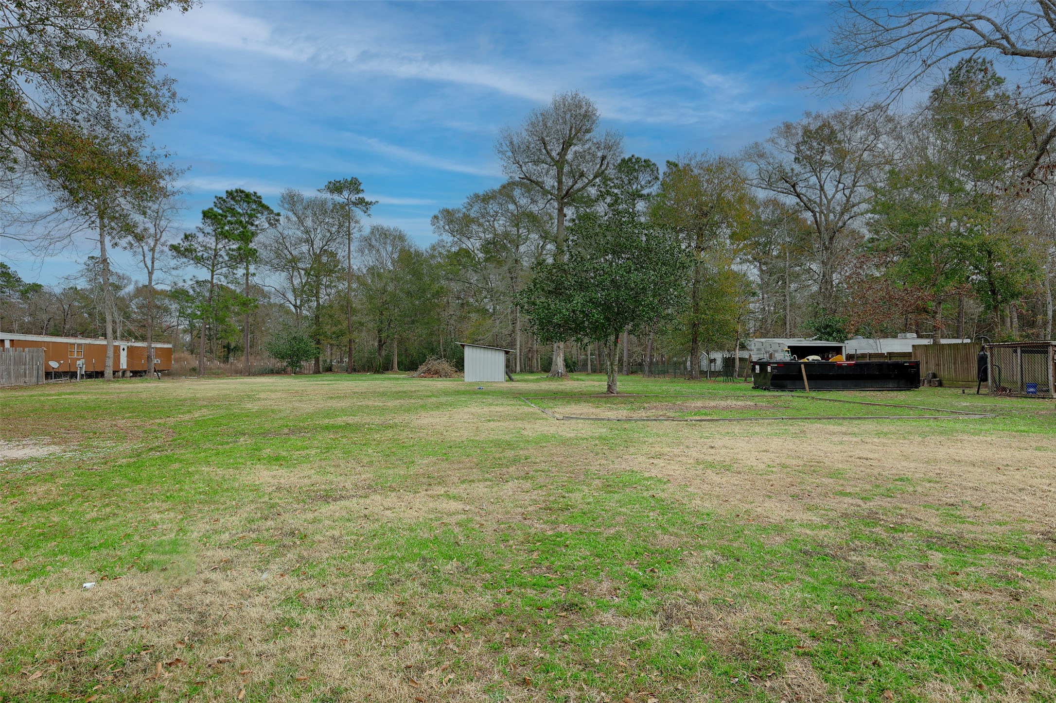 2373 Crockett Martin Road Conroe, TX 77306 - Photo 24 of 34 View of the Water Well and a view of the Back of the Property where it is partially wooded.