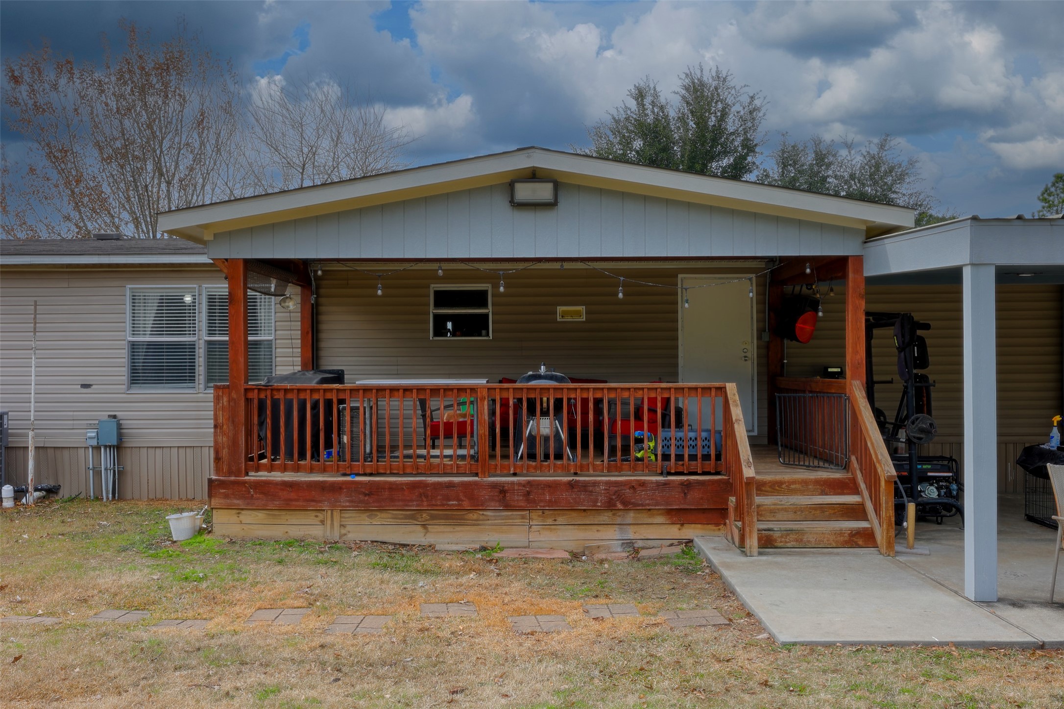 2373 Crockett Martin Road Conroe, TX 77306 - Photo 7 of 34 Covered Patio and Wood Deck measuring 20x13.