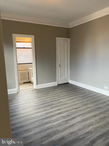 2031 Locust Street, Unit 103 Philadelphia, PA 19103 - Photo 7 of 16 a view of empty room with wooden floor
