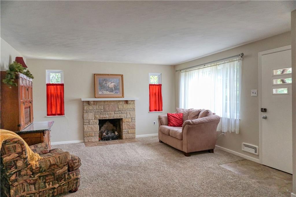 104 Church Road Butler, PA 16002 - Photo 3 of 21 a living room with furniture and a fireplace