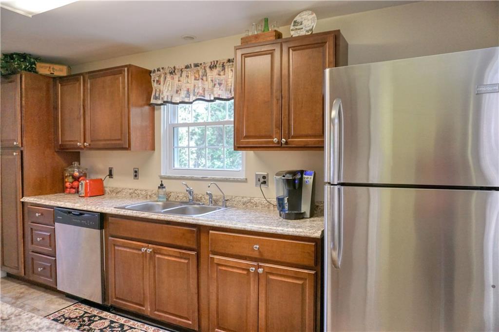 104 Church Road Butler, PA 16002 - Photo 9 of 21 a kitchen with stainless steel appliances granite countertop a refrigerator a sink and dishwasher